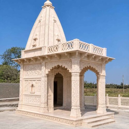 Front view of a custom 6x10x15 ft Bansi Paharpur sandstone temple with carved pillars and Shikhara by Natural Stone Industries